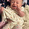 Kennedy is registered to the contest to win money with this photo: baby, infant, smiling, laughing, pajamas, polka_dot, blanket, unicorn, stars, soft_texture, cute, child, happy, indoors, comfort, playful, clothing, portrait, sitting, expression