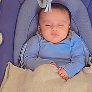 Afnan joined the competition — help win amazing prizes! baby, sleeping, blanket, blue_clothing, baby_seat, plush_toy, cozy, infant, peaceful, child, soft_texture, indoor, cute, resting, head, closed_eyes, small_hands, comfort, naptime, portrait