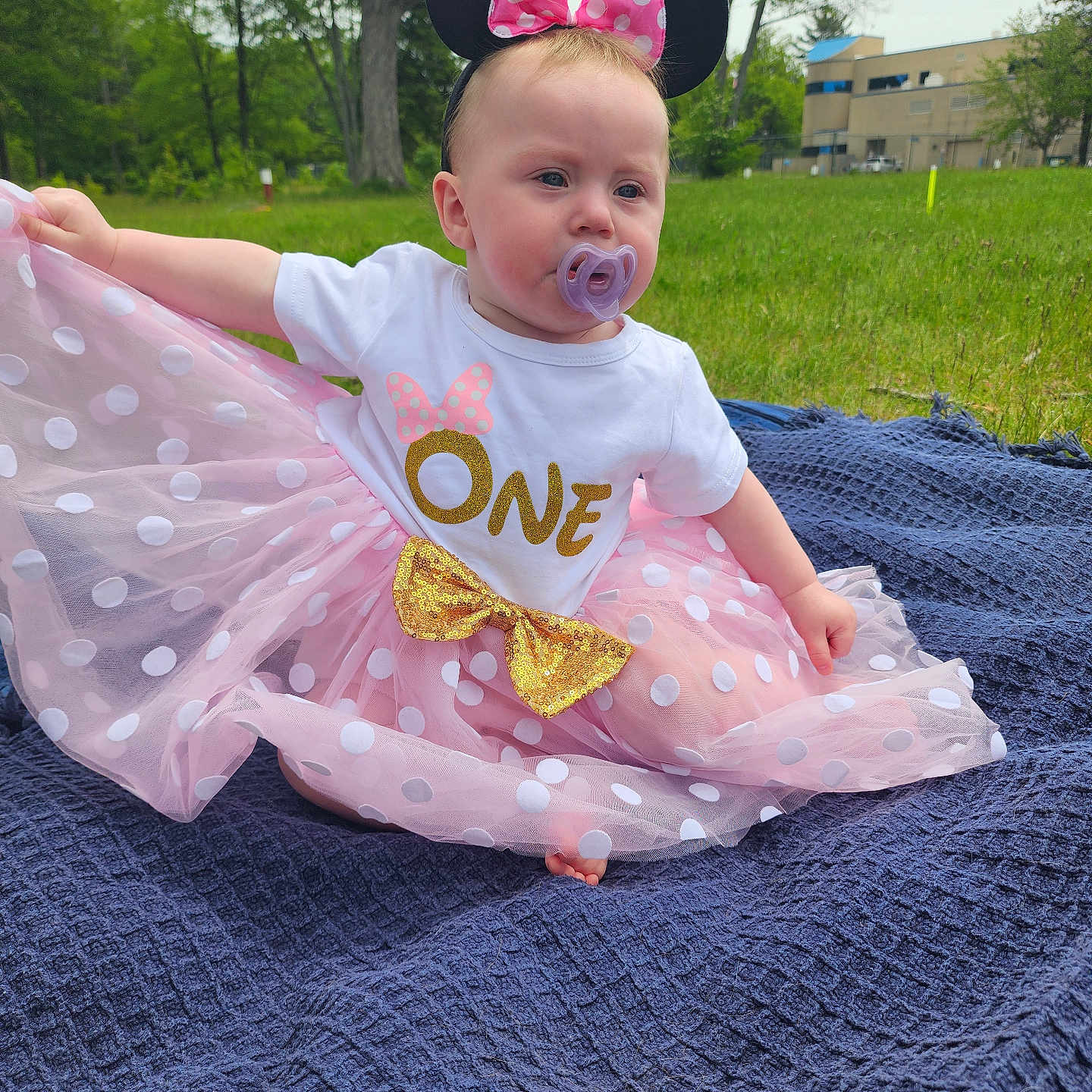 Willow is registered to the contest to win money with this photo: baby, blanket, car, clothing, dress, face, grass, hat, head, nature, outdoors, park, person, photography, plant, portrait, quilt, summer, t_shirt, tree