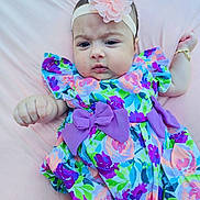 Zamira joined the competition — help win amazing prizes! baby, infant, child, dress, floral_pattern, bow, headband, flower, pink, purple, blue, green, lying_down, blanket, cute, portrait, person, skin, hand, fashion