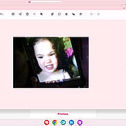 Alliyah is registered to the contest to win money with this photo: child, face, device_screen, hand, blurry, pixelated, portrait, expression, indoor, digital_photo, mobile_device, dark_background, person, young_child, scrunched_face, curly_hair, technology, photo_capture, close_up, screen