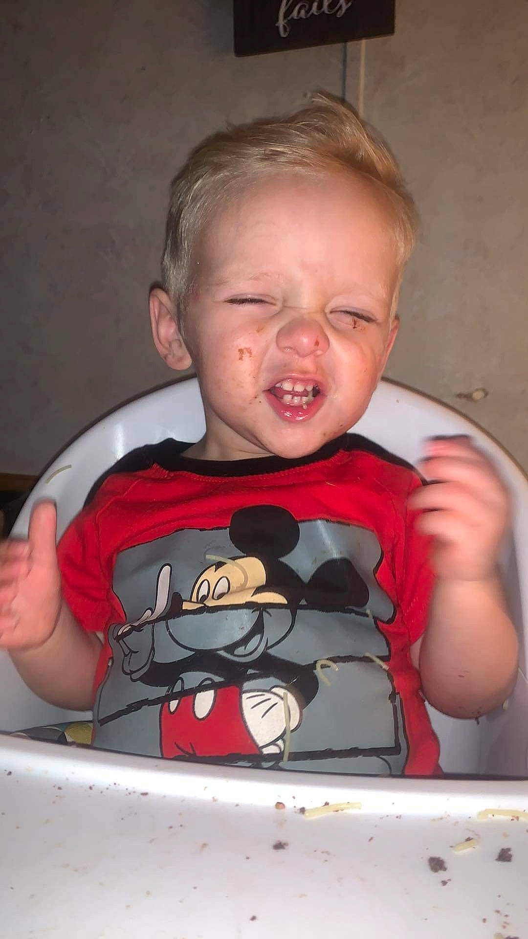 Tylin is registered to the contest to win money with this photo: angry_birds, arm, baby, baby_toddler_clothing, carmine, cheek, child, chin, eyelash, fun, gesture, happy, human_body, mouth, nose, person, room, sitting, sleeve, t_shirt