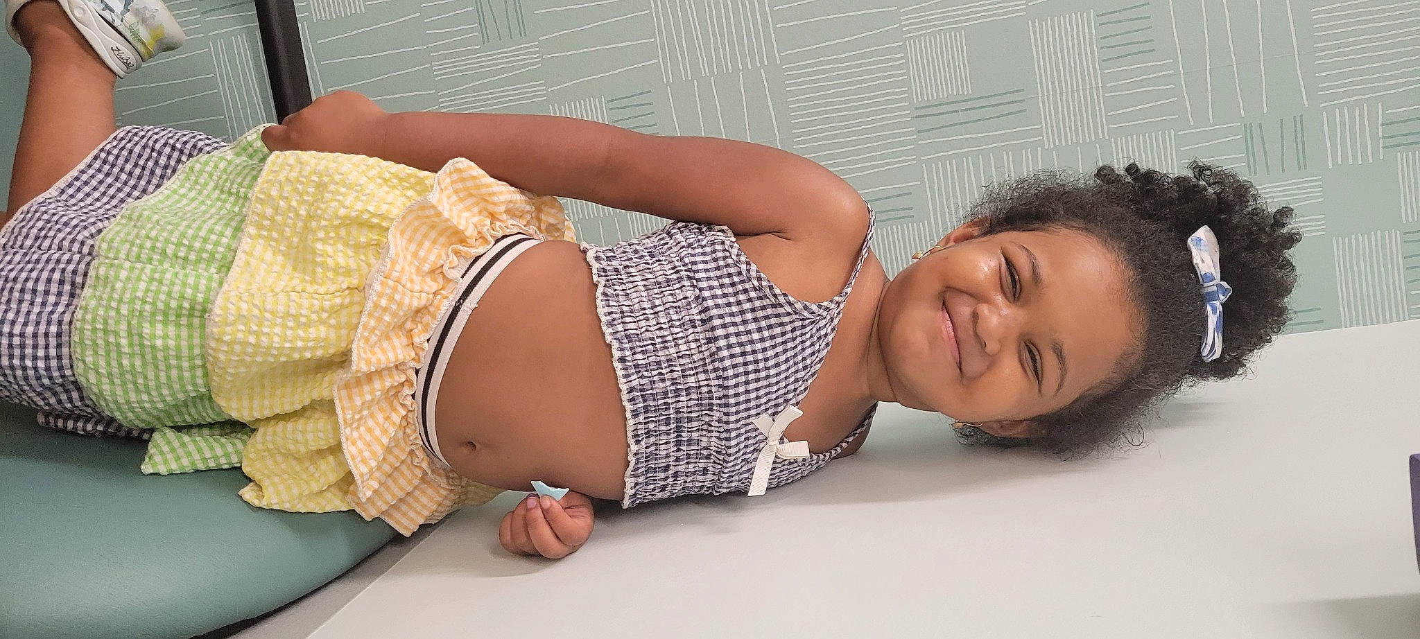 Kayla is registered to the contest to win money with this photo: abdomen, chest, child, comfort, elbow, eyelash, finger, human_body, human_leg, joint, joy, knee, muscle, neck, person, shoulder, skin, smile, stomach, thigh