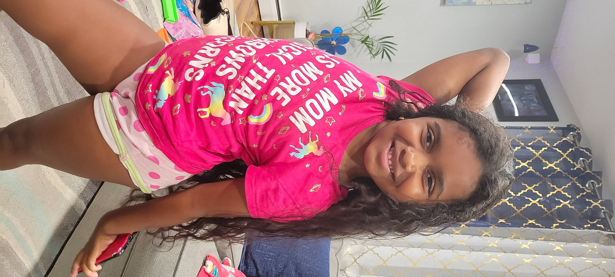 Kendra is registered to the contest to win money with this photo: abdomen, eyelash, flooring, font, fun, happy, houseplant, human_leg, joy, magenta, pattern, person, picture_frame, pink, plant, skin, sleeve, smile, t_shirt, thigh