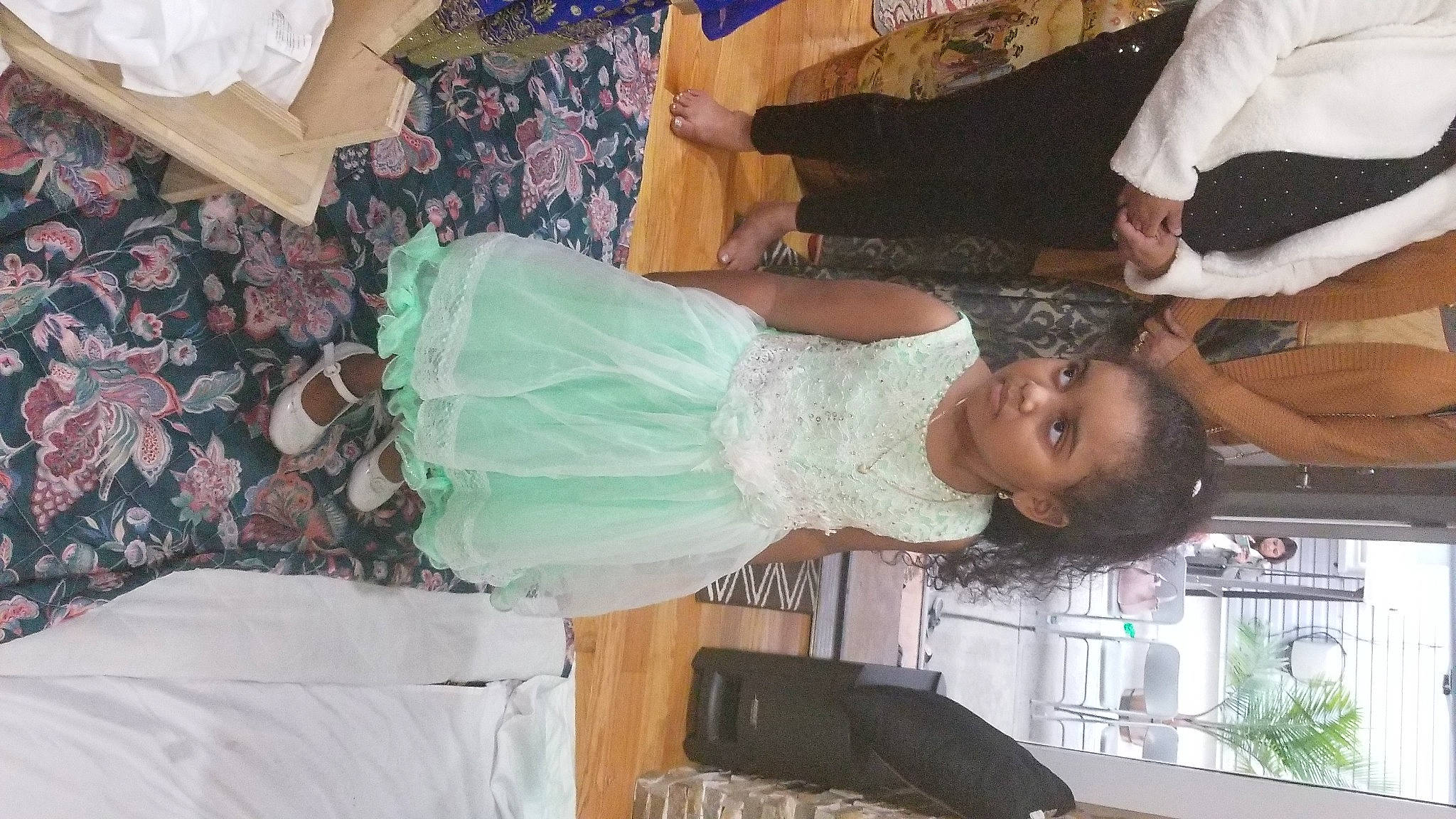 Kendra is registered to the contest to win money with this photo: child, costume, event, fashion_design, formal_wear, fun, happy, person, plant, room, smile