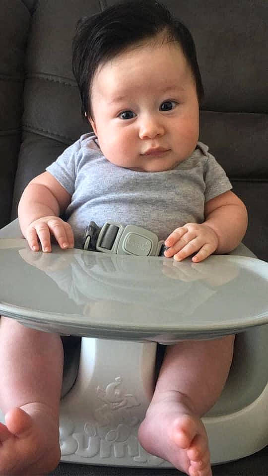 Julius is registered to the contest to win money with this photo: baby, child, finger, hand, leg, person, sitting, skin, toddler