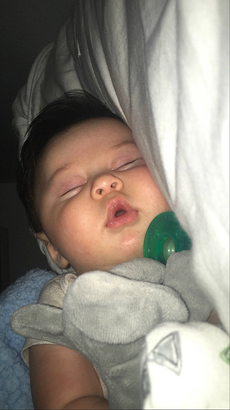 Julius is registered to the contest to win money with this photo: baby, bedtime, cheek, child, eye, face, lip, mouth, nap, nose, person, skin, sleep, toddler