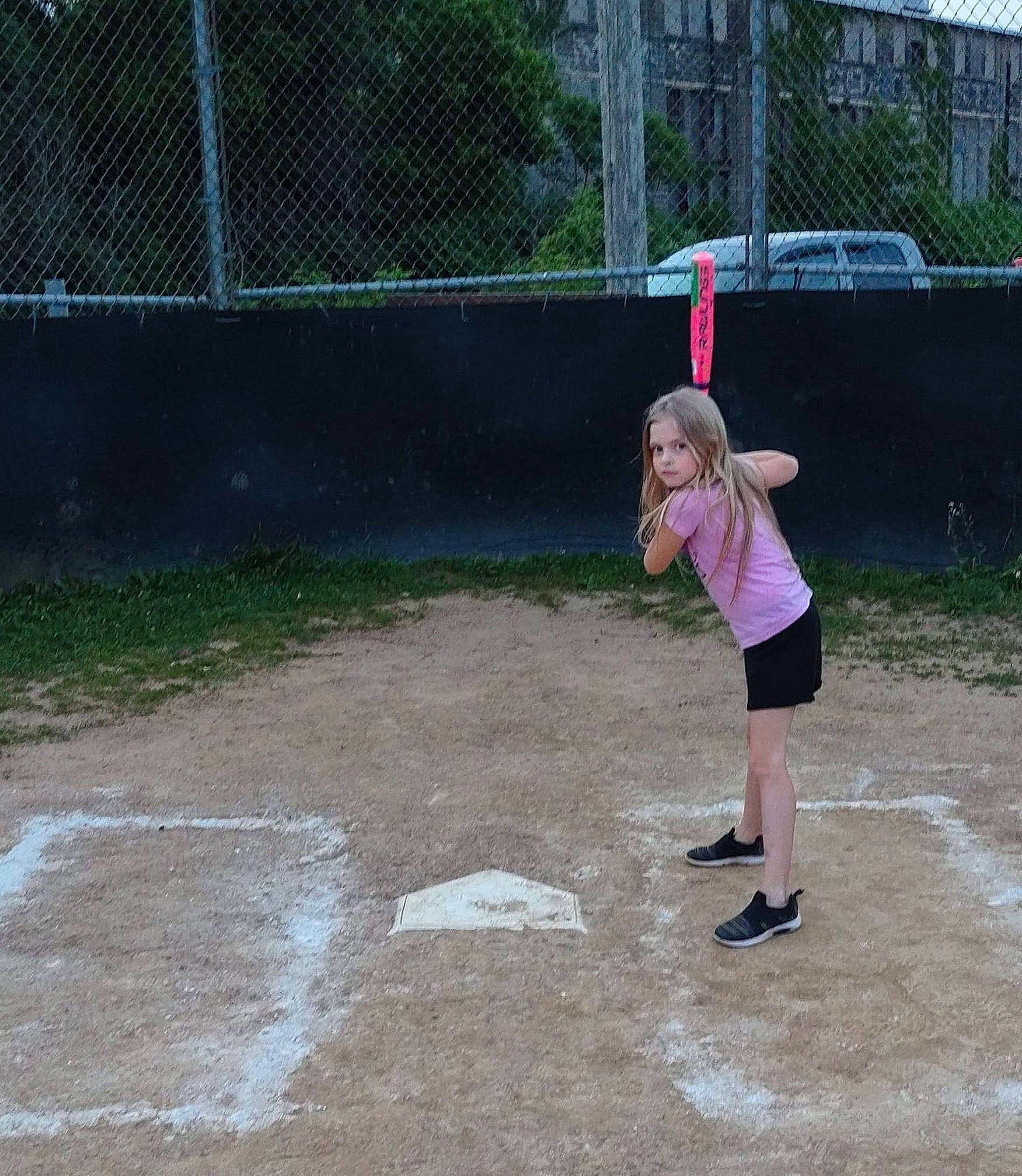 Love is registered to the contest to win money with this photo: asphalt, city, concrete, driveway, fence, fun, grass, landscape, lawn, leisure, mesh, person, play, recreation, road, road_surface, shorts, sidewalk, soil, toddler