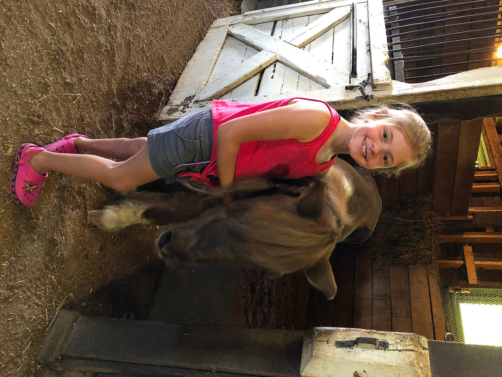 Love is registered to the contest to win money with this photo: arm, boot, elbow, fun, hat, human_body, human_leg, joy, knee, landscape, leisure, magenta, person, thigh, waist, wood