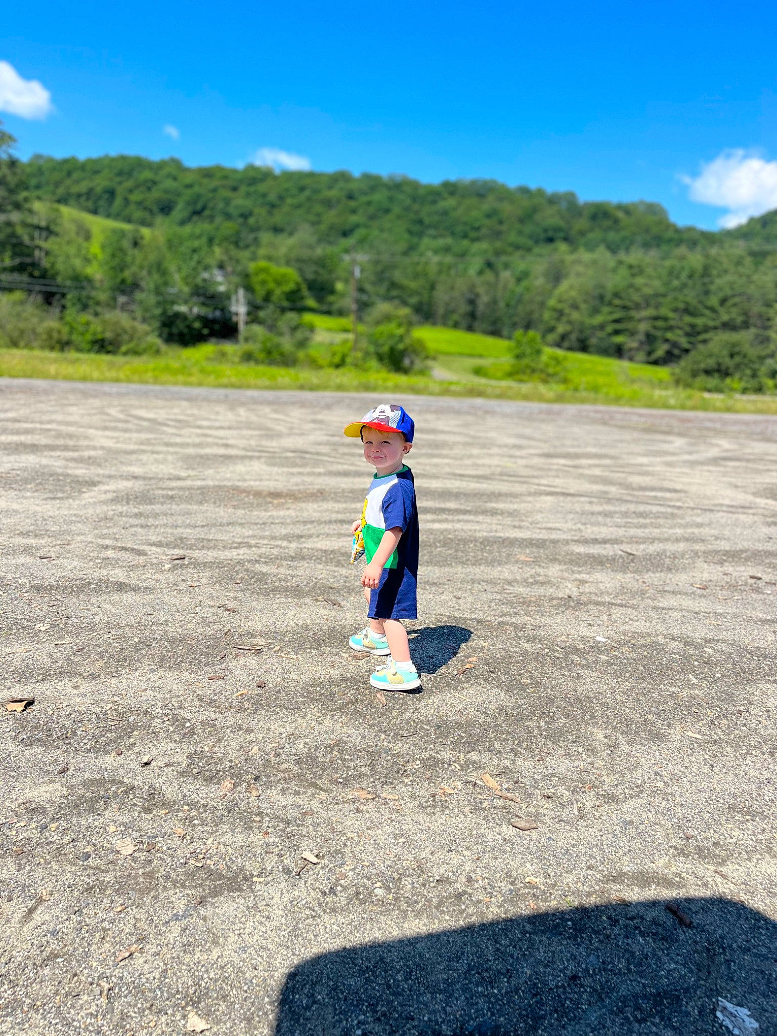 Arthur joined the competition — help win amazing prizes! asphalt, cloud, electric_blue, fun, grass, grassland, headgear, headwear, joy, landscape, leisure, mountain, people_in_nature, person, plain, plant, recreation, road, road_surface, sky