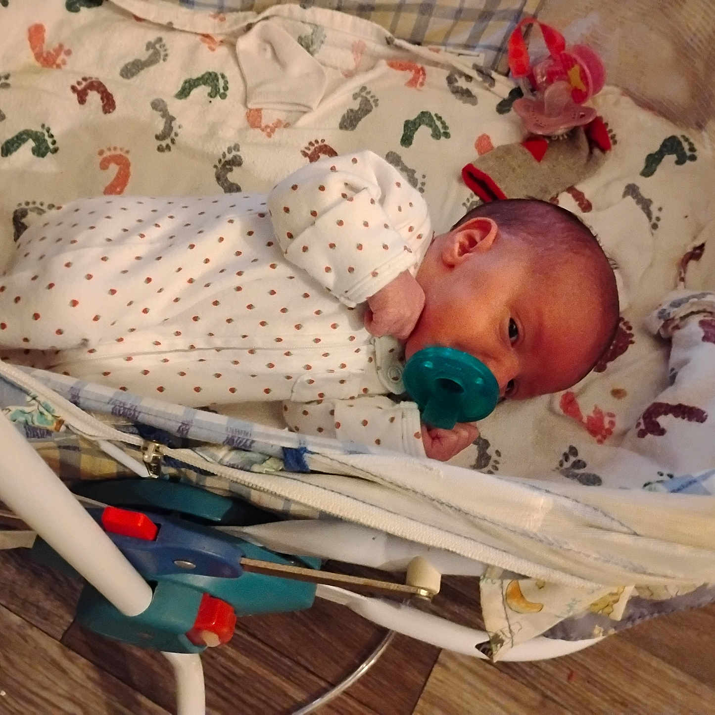 Kate joined the competition — help win amazing prizes! baby, baby_accessory, baby_bed, baby_clothing, baby_face, baby_hand, baby_lying, baby_sleeping, bassinet, blanket, cozy, crib, footprint_pattern, infant, newborn, onesie, pacifier, sleepwear, sock, wooden_floor