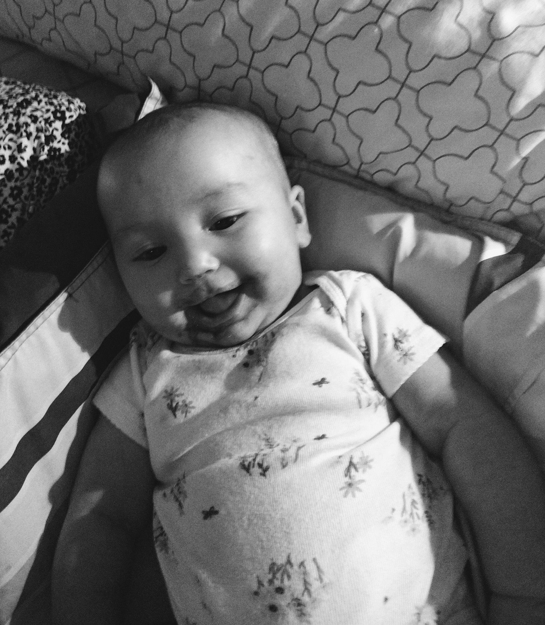 Willow is registered to the contest to win money with this photo: baby, baby_toddler_clothing, black_and_white, cheek, comfort, eye, eyebrow, facial_expression, flash_photography, happy, head, iris, monochrome, mouth, person, skin, sleeve, smile, style, textile