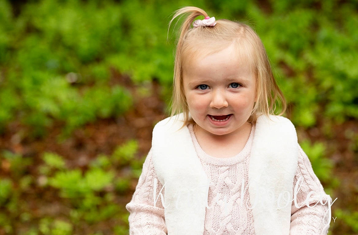 Paisley is registered to the contest to win money with this photo: baby, baby_toddler_clothing, blond, child, eye, face, fun, grass, grass_family, happy, headband, iris, jewellery, people_in_nature, person, plant, sleeve, smile, sunlight, toddler