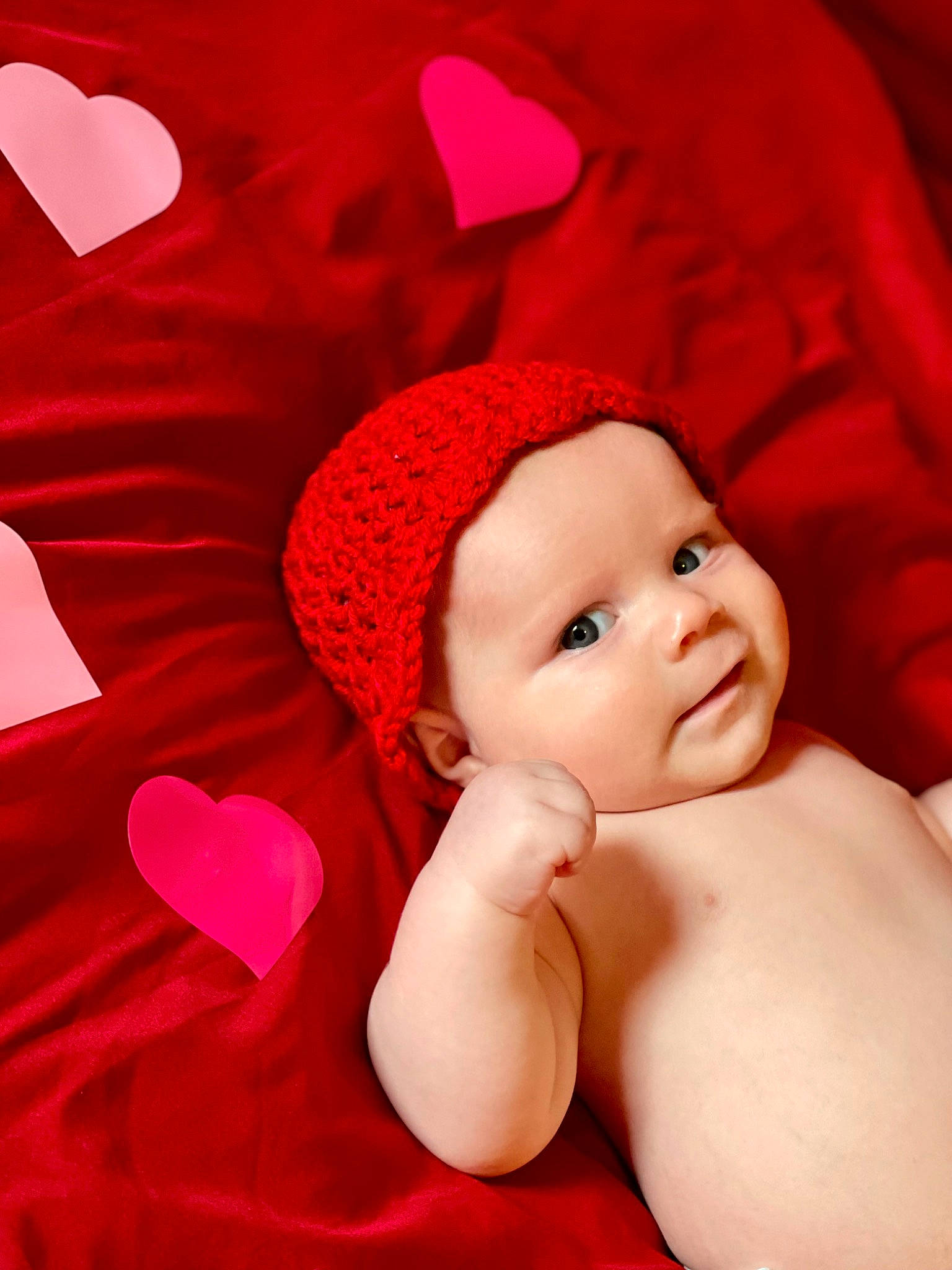 Astrid is registered to the contest to win money with this photo: baby, baby_sleeping, baby_toddler_clothing, cap, carmine, child, comfort, costume_hat, fashion_accessory, fun, happy, hat, headgear, headwear, linens, magenta, person, petal, pink, smile