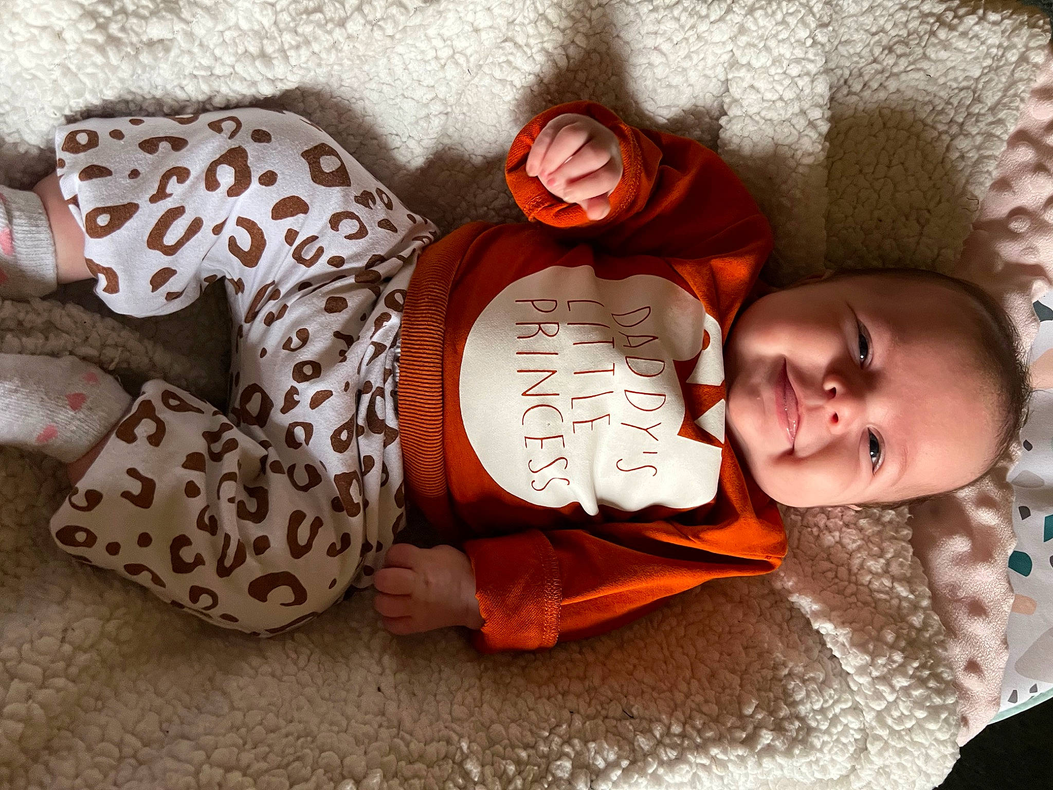 Kourtney is registered to the contest to win money with this photo: baby, baby_products, baby_sleeping, baby_toddler_clothing, bedtime, brown, child, comfort, cool, facial_expression, hand, headgear, joy, orange, pattern, person, sitting, skin, sleeve, textile