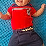 Carter-Ross joined the competition — help win amazing prizes! baby, child, smile, red_shirt, navy_shorts, blue_blanket, infant, cute, happy, lying_down, barefoot, portrait, indoors, person, small_child, soft_texture, casual_clothing, young, playful, comfortable