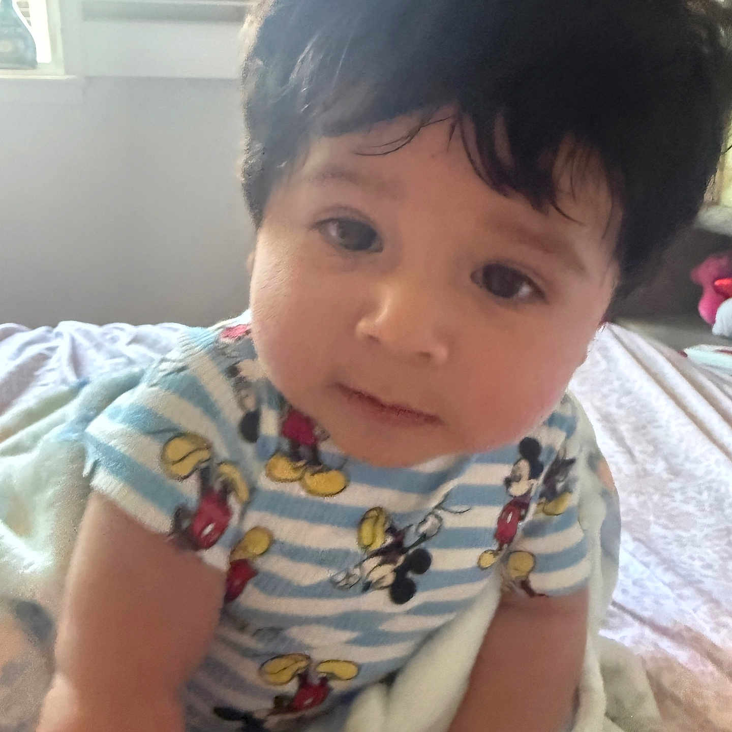 Jayce Asher joined the competition — help win amazing prizes! baby, bed, blanket, candid, child, closeup, curious, cute, expression, face, hair, indoor, infant, mickey_mouse, person, portrait, soft_lighting, striped_clothing, toddler, young_child