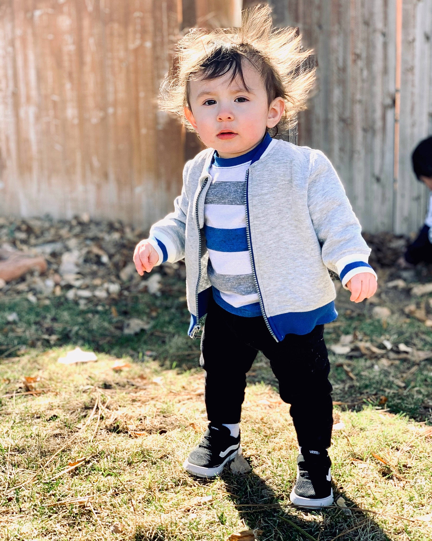 Emilio joined the competition — help win amazing prizes! baby, child, child_model, grass, jacket, outerwear, people, person, photography, play, sleeve, standing, t_shirt, toddler, under_exposed