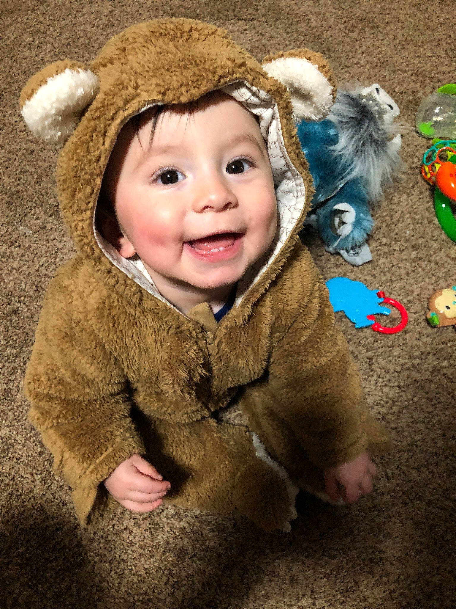 Emilio is registered to the contest to win money with this photo: baby, cheek, child, ear, fun, fur, fur_clothing, happy, headwear, joy, laugh, outerwear, person, photography, play, skin, smile, toddler