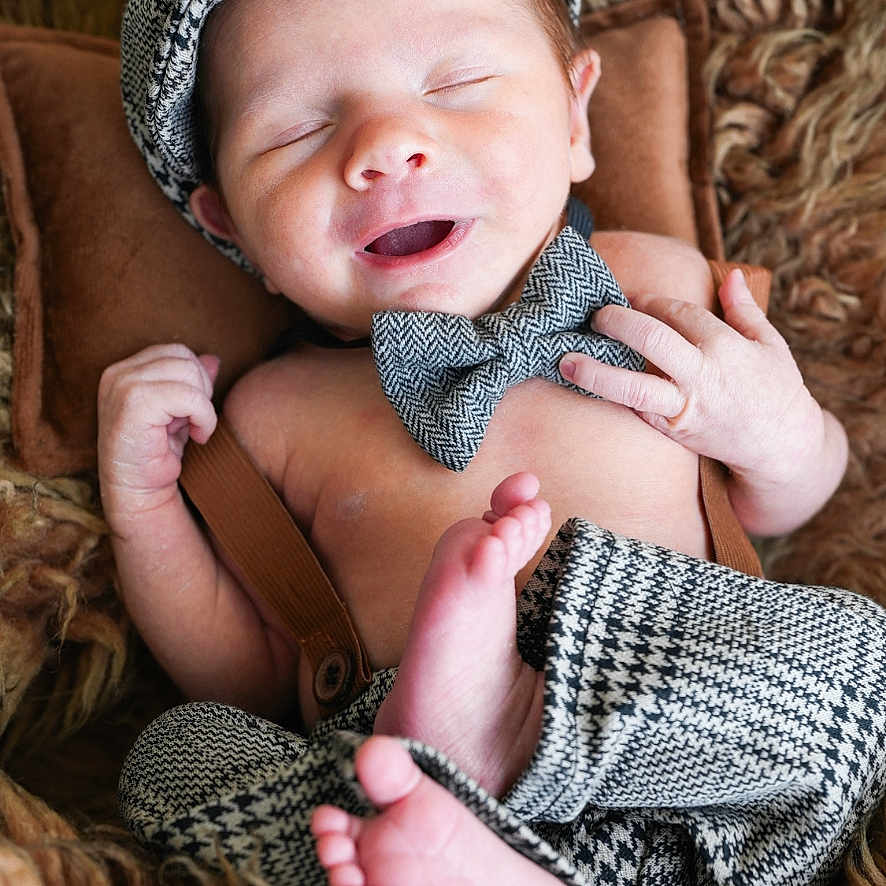 Grayson joined the competition — help win amazing prizes! baby, beanie, bodypart, bonnet, cap, clothing, couch, face, finger, furniture, hand, happy, hat, head, newborn, person, photography, portrait, sleeping, smile