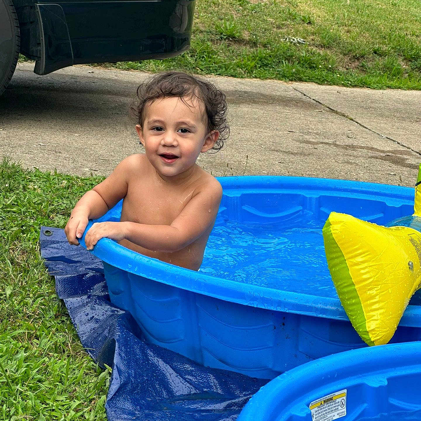Jordan is registered to the contest to win money with this photo: architecture, baby, backyard, bathing, building, face, grass, head, nature, outdoors, person, photography, plant, pool, portrait, pottedplant, shelter, summer, water, yard