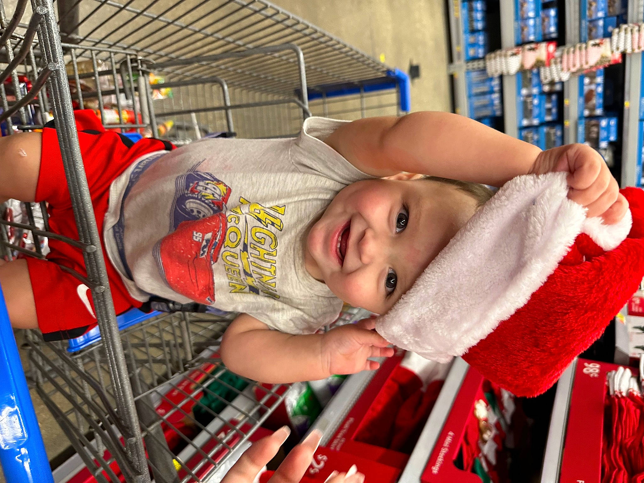 Fernando is registered to the contest to win money with this photo: baby, baby_products, baby_toddler_clothing, bookcase, child, customer, engineering, fun, headwear, joy, leisure, person, product, publication, retail, shelf, shelving, smile, t_shirt, toddler