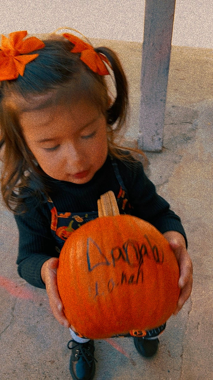 Miah joined the competition — help win amazing prizes! calabaza, child, cucurbita, fun, gourd, handwriting, happy, jack_o_lantern, local_food, natural_foods, orange, people, person, plant, pumpkin, sitting, squash, toddler, trick_or_treat, vegetable