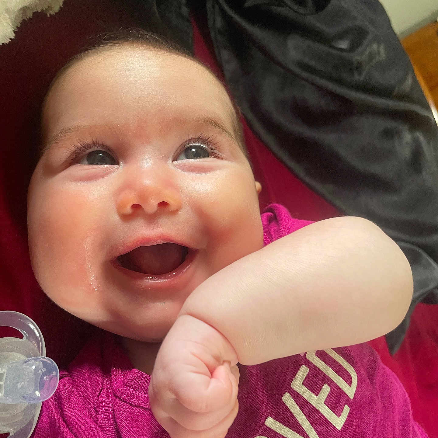 Leah Grace joined the competition — help win amazing prizes! baby, blanket, child, closeup, clothing, cute, expression, face, hand, happy, human, indoors, infant, joyful, lying_down, pacifier, portrait, purple_shirt, skin, smiling