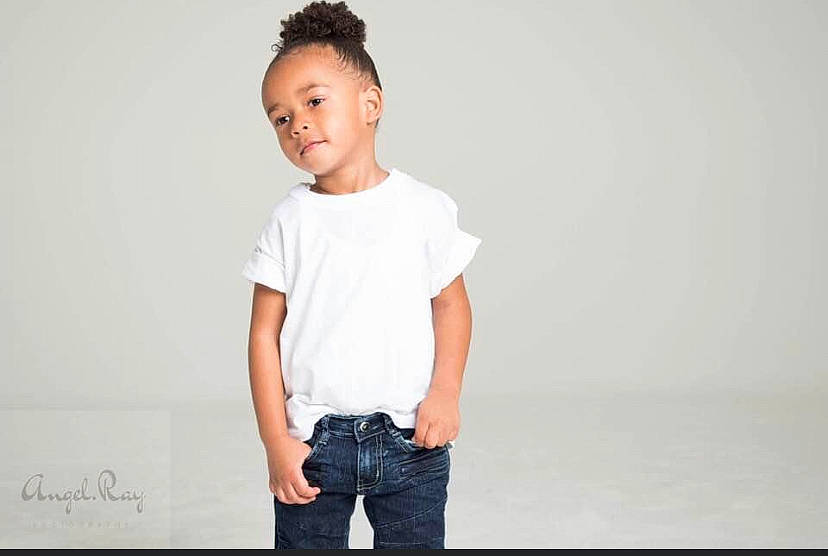 Adrien is registered to the contest to win money with this photo: child, clothing, collar, denim, dress_shirt, elbow, fashion_design, flash_photography, gesture, grey, hair, happy, human_body, jeans, person, sleeve, standing, street_fashion, t_shirt, toddler