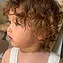 Achille a rejoint le concours — aidez-le/la à gagner de superbes lots ! toddler, child, curly_hair, profile, overalls, striped_clothing, indoor, soft_light, portrait, young_child, face, skin, button, hair, person, cute, looking_away, casual, childhood, baby