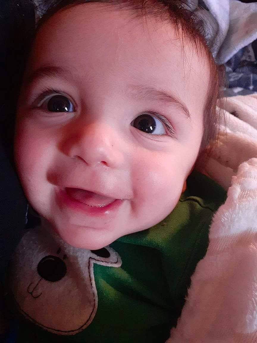 Enrique is registered to the contest to win money with this photo: baby, baby_toddler_clothing, cheek, chin, ear, eye, eyebrow, eyelash, face, gesture, hairstyle, head, iris, joy, lip, mammal, mouth, nose, person, skin