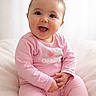 Aliya a rejoint le concours — aidez-le/la à gagner de superbes lots ! baby, child, pink_clothing, smiling, happy, sitting, indoor, soft_light, cute, infant, portrait, cozy, fluffy, blanket, one_person, young_child, face, head, hands, background