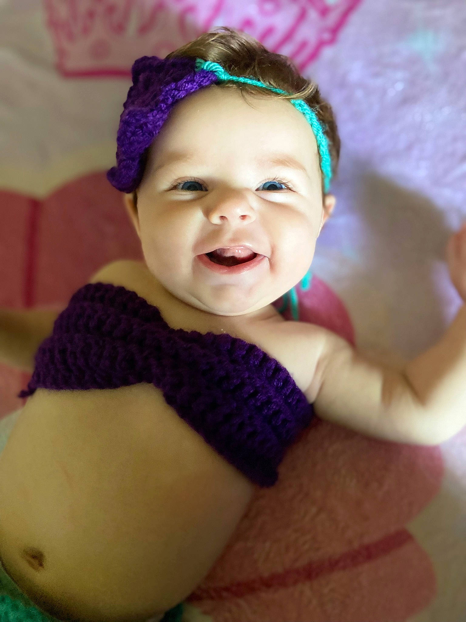 Amarie is registered to the contest to win money with this photo: art, baby, baby_toddler_clothing, cap, chin, eye, eyebrow, face, hair, happy, head, headgear, iris, lip, person, pink, purple, skin, smile, textile