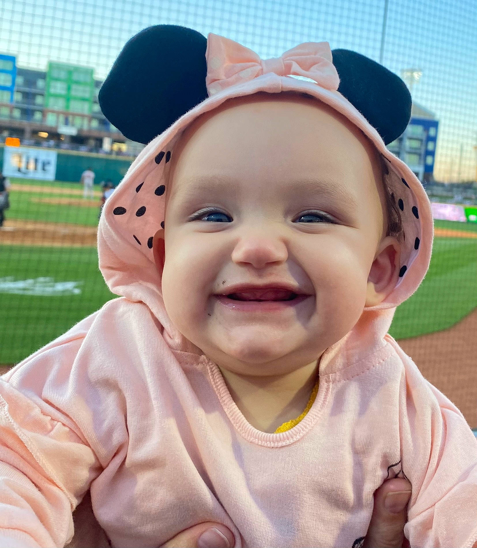 Emileigh is registered to the contest to win money with this photo: baby, baby_laughing, baby_toddler_clothing, baseball_cap, cap, cool, fun, gesture, grass, happy, hat, headgear, headwear, joy, lip, mouth, nose, person, pink, skin