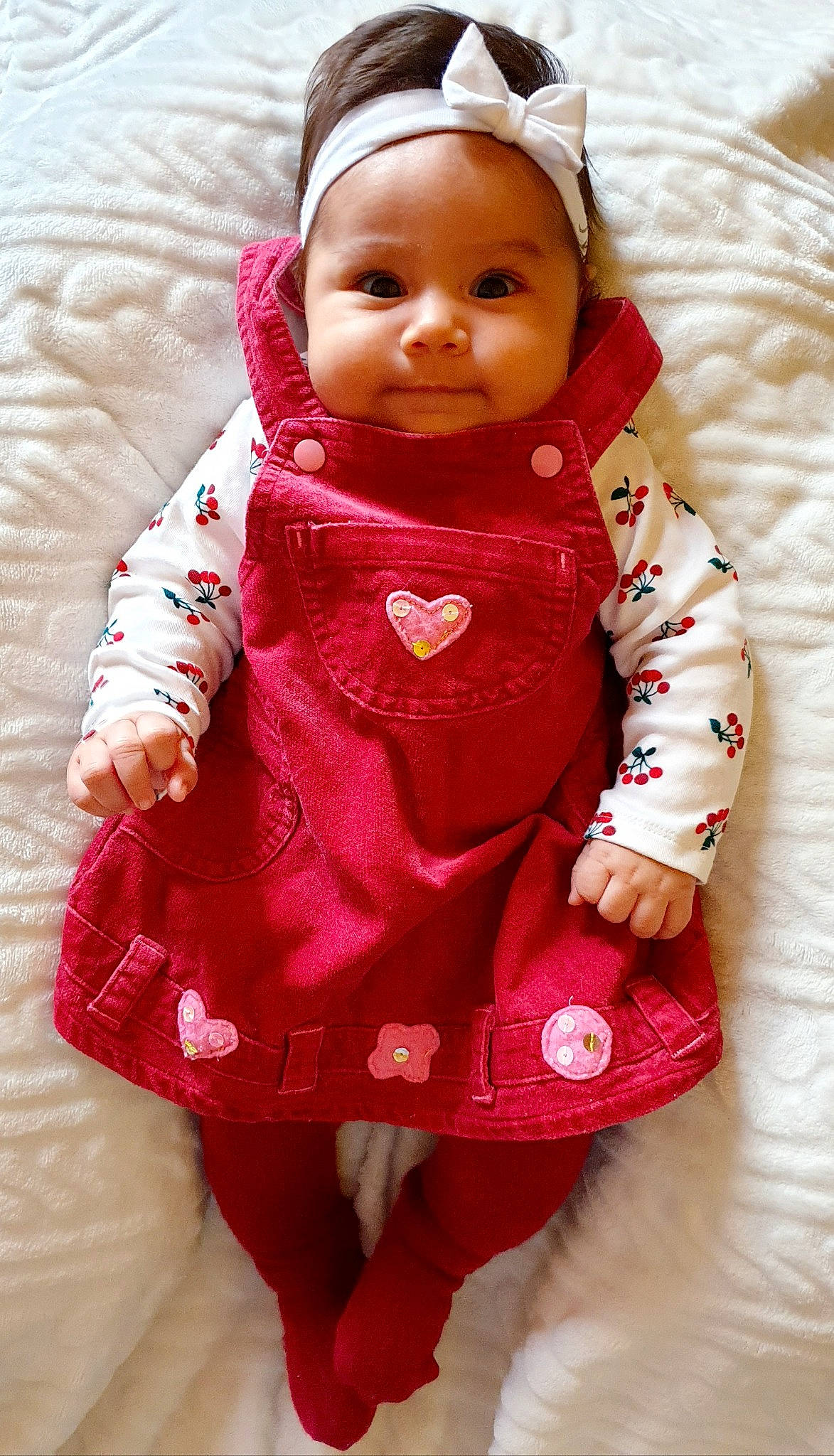 Maïra a rejoint le concours — aidez-le/la à gagner de superbes lots ! arm, baby, baby_toddler_clothing, cheek, child, collar, eye, face, happy, head, headwear, jacket, lip, outerwear, person, pink, skin, sleeve, smile, textile