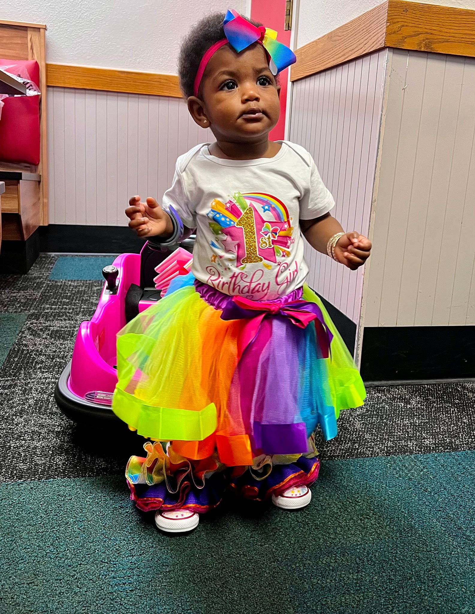 Lauren joined the competition — help win amazing prizes! baby, baby_toddler_clothing, child, clothing, costume, entertainment, event, flooring, fun, happy, leisure, magenta, person, pink, purple, red, sandal, shoe, sitting, toddler