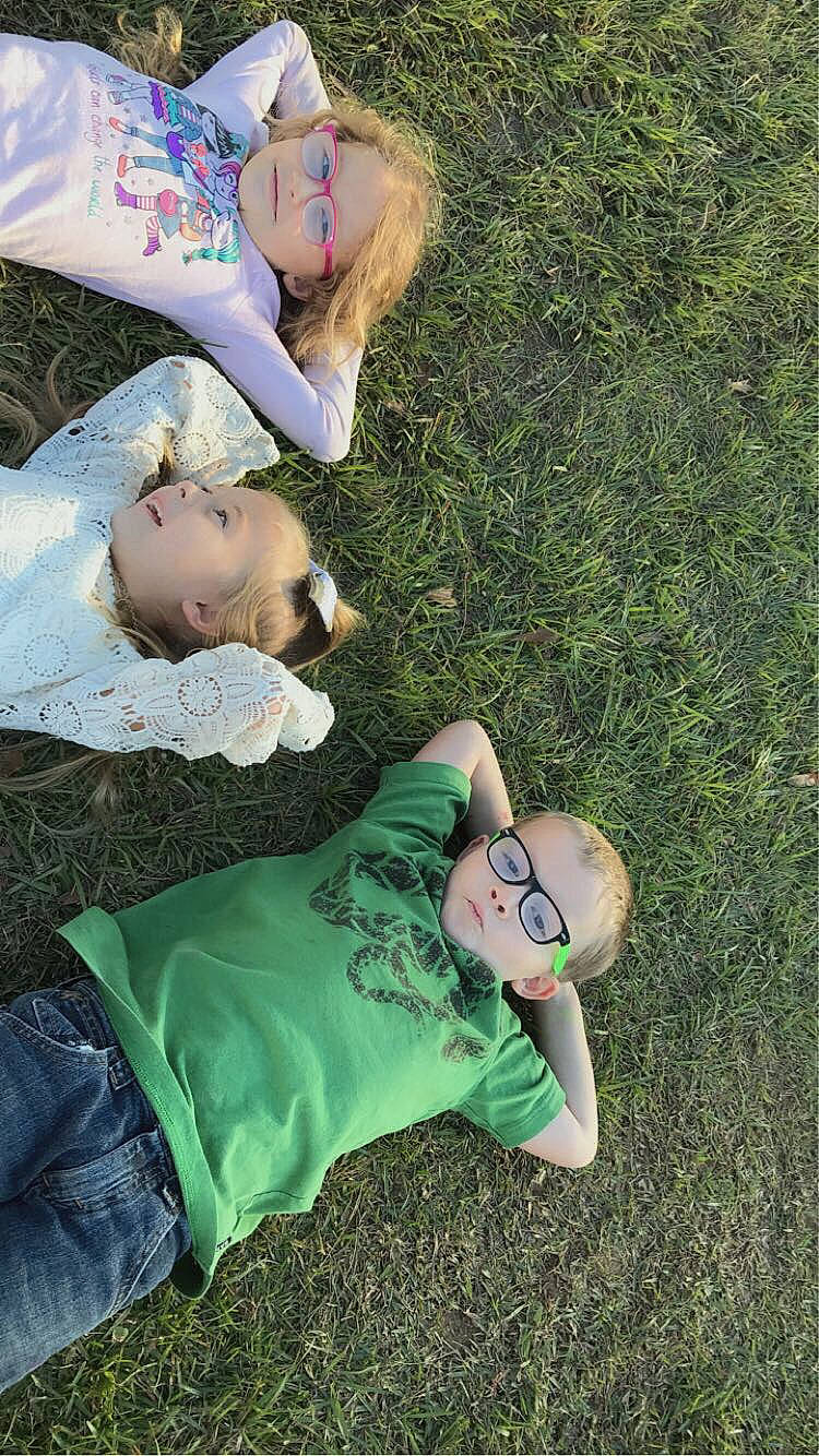 Maci is registered to the contest to win money with this photo: baby, ball, child, comfort, eyewear, fun, grass, grassland, green, happy, hat, lawn, leisure, nap, people_in_nature, person, play, recreation, sitting, toddler