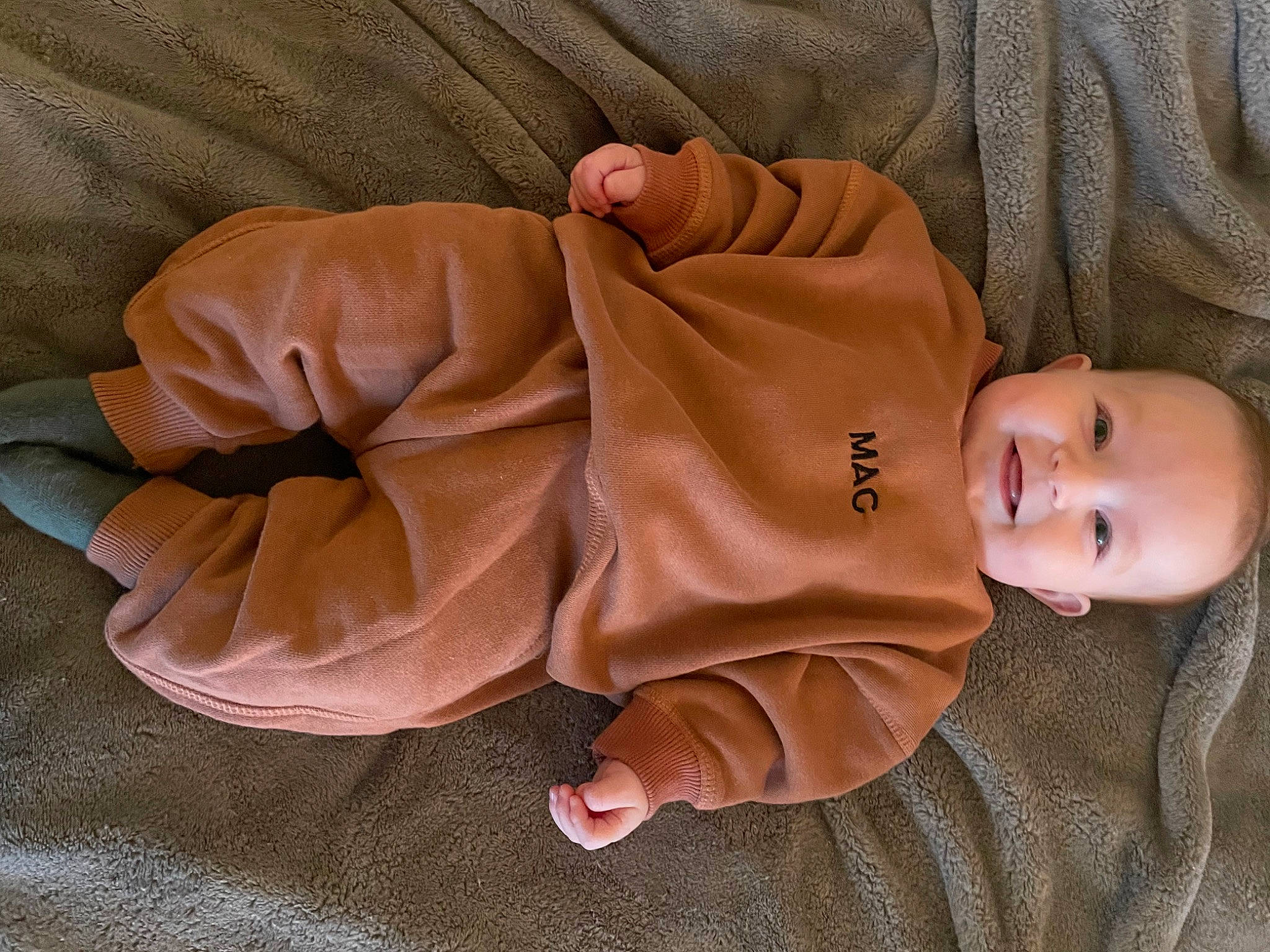 Malcolm joined the competition — help win amazing prizes! baby, baby_products, baby_sleeping, baby_toddler_clothing, child, comfort, fashion_accessory, finger, fur, hat, human_body, joy, linens, mammal, outerwear, peach, person, skin, sleeve, smile
