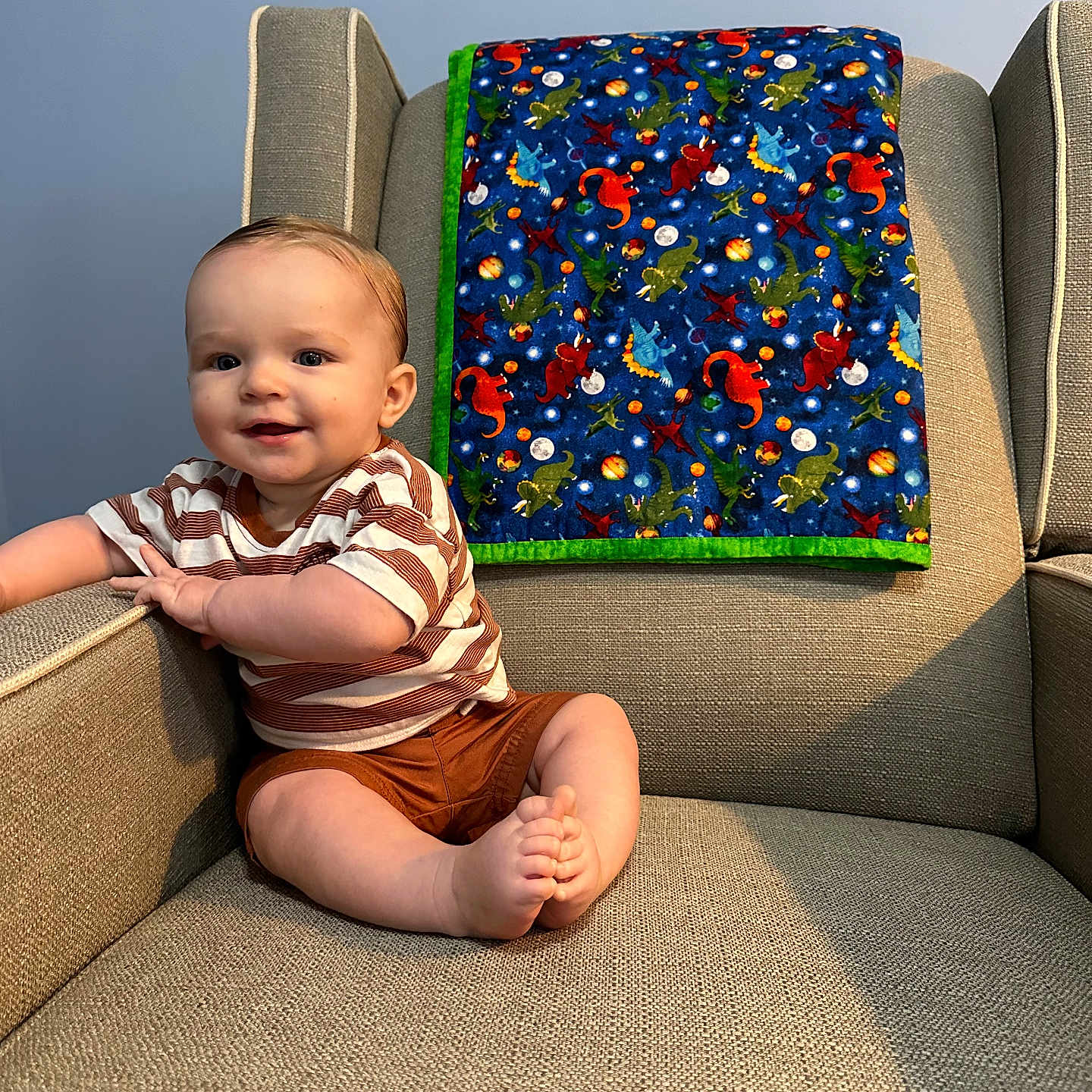 Clayton is registered to the contest to win money with this photo: architecture, baby, chair, clothing, couch, cushion, face, furniture, happy, head, homedecor, indoors, interiordesign, pants, person, photography, portrait, shorts, sitting, smile