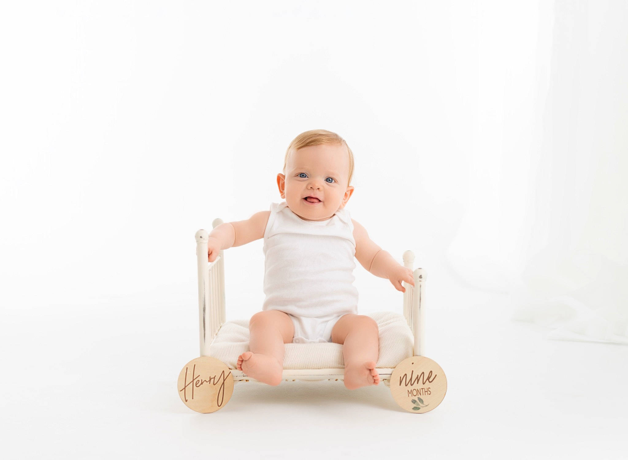 Henry is registered to the contest to win money with this photo: baby, baby_products, baby_toddler_clothing, baby_toys, barefoot, comfort, foot, happy, human_body, human_leg, knee, leg, person, sleeve, smile, stomach, thigh, thumb, toddler, wood