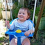 baby, child, swing, outdoor, grass, greenery, smile, happy, rope, blue, plastic, pot, plant, garden, sunlight, clothing, person, seat, playing, fun