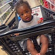 Markale joined the competition — help win amazing prizes! baby, shopping_cart, grocery_store, aisle, child, striped_shirt, curious, person, footwear, floor, shelf, products, plastic, shopping, retail, store, young_child, indoor, shopping_cart_seat, infant