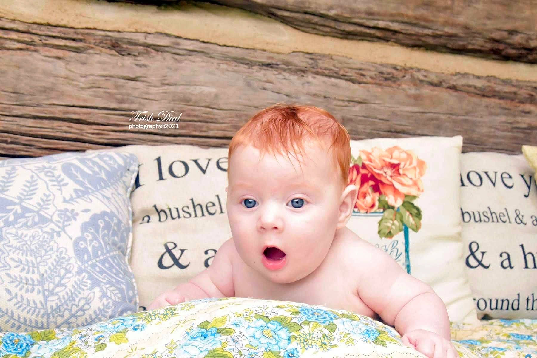 Grayson joined the competition — help win amazing prizes! baby, baby_toddler_clothing, bedding, child, comfort, eye, face, facial_expression, fun, grass, happy, head, leisure, linens, pattern, person, sitting, skin, surprise, toddler