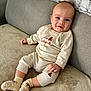 Louka participe au concours pour gagner de l'argent avec cette photo : baby, infant, smile, socks, couch, blanket, cozy, clothing, cute, happy, indoors, child, portrait, soft, comfortable, sitting, face, head, person, warm