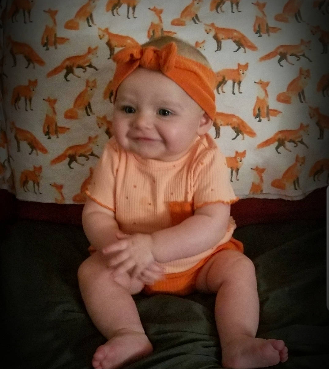 Mya-lee joined the competition — help win amazing prizes! baby, baby_toddler_clothing, cheek, child, comfort, dress, eye, happy, headgear, headwear, human_body, human_leg, joy, knee, pattern, peach, person, pink, skin, sleeve
