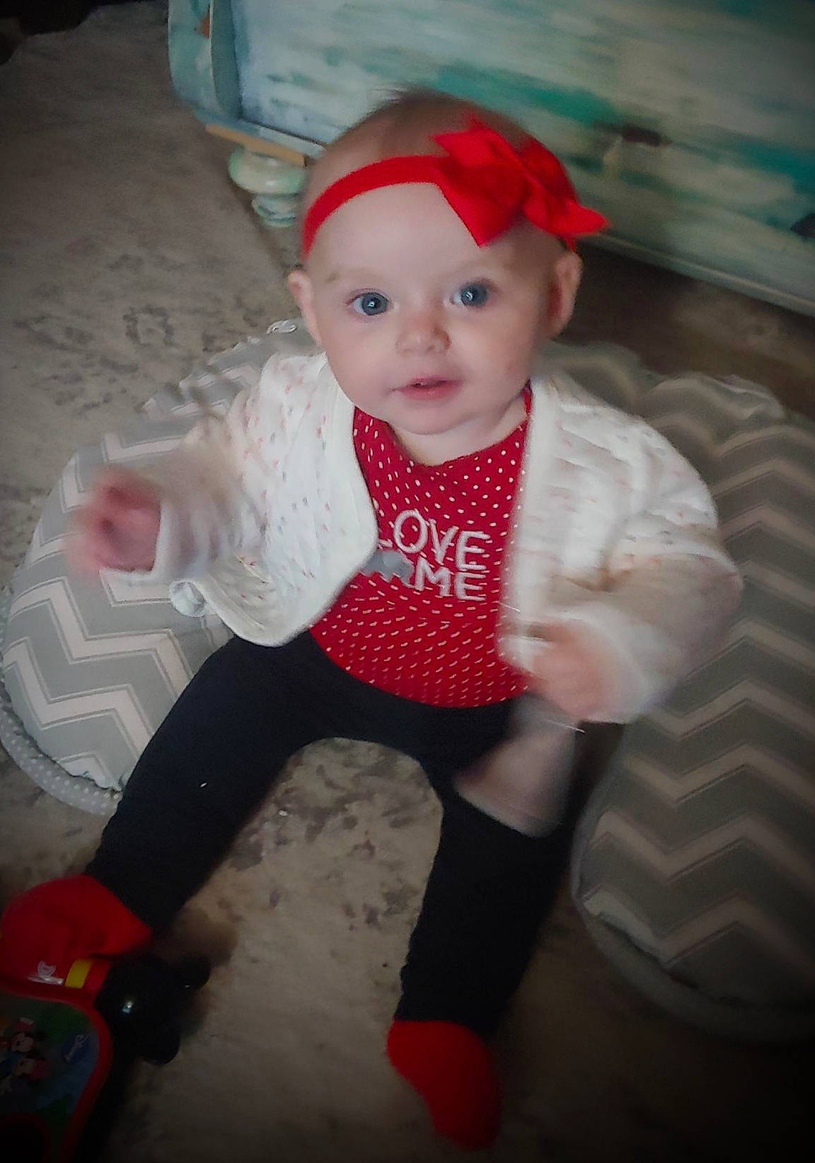Mya-lee is registered to the contest to win money with this photo: baby, baby_toddler_clothing, cap, carmine, cheek, child, costume_hat, doll, fun, fur, hat, head, headwear, pattern, person, sitting, sleeve, toddler, toy, wig