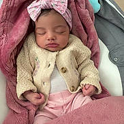 Milani joined the competition — help win amazing prizes! baby, sleeping, blanket, headband, pink, knitted_sweater, infant, cozy, cute, peaceful, indoors, soft_texture, child, clothing, comfort, resting, newborn, portrait, warm, wrapped