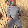 Ezaia joined the competition — help win amazing prizes! baby, infant, pacifier, blanket, beanie, clothing, blue_outfit, nike_logo, lying_down, soft_texture, indoor, cute, child, headwear, sock, comfort, portrait, young_child, cozy, relaxed
