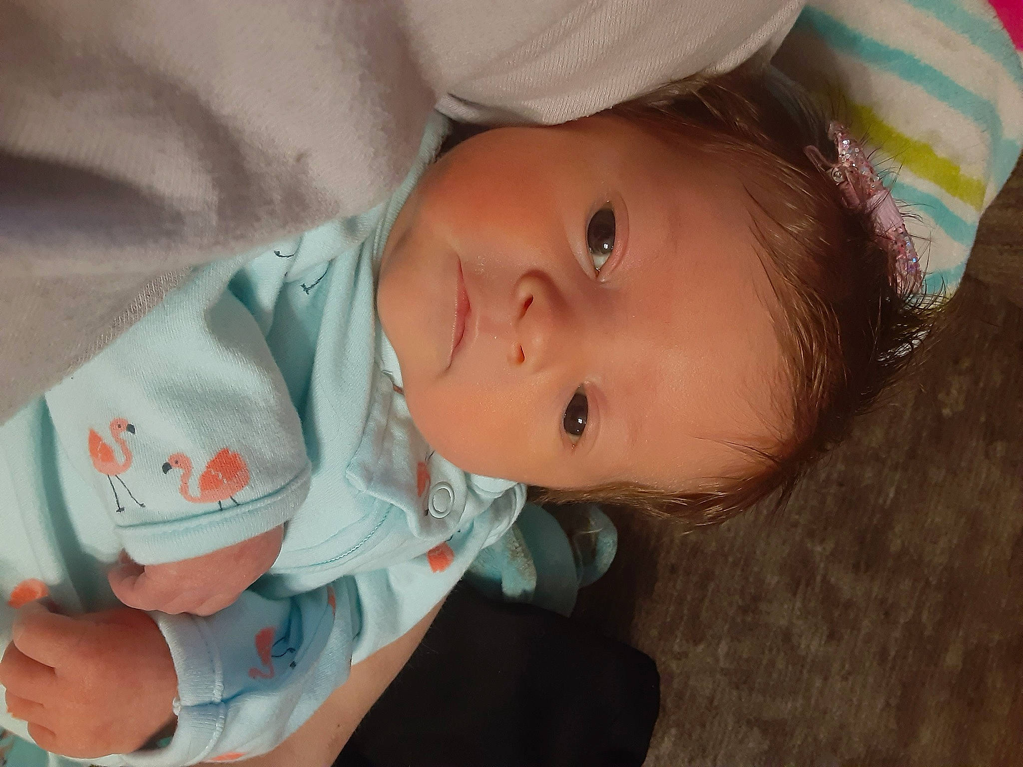 Alice is registered to the contest to win money with this photo: arm, baby, baby_products, baby_toddler_clothing, cheek, child, chin, comfort, eyelash, happy, human_body, iris, lip, mouth, nose, person, sitting, skin, smile, toddler