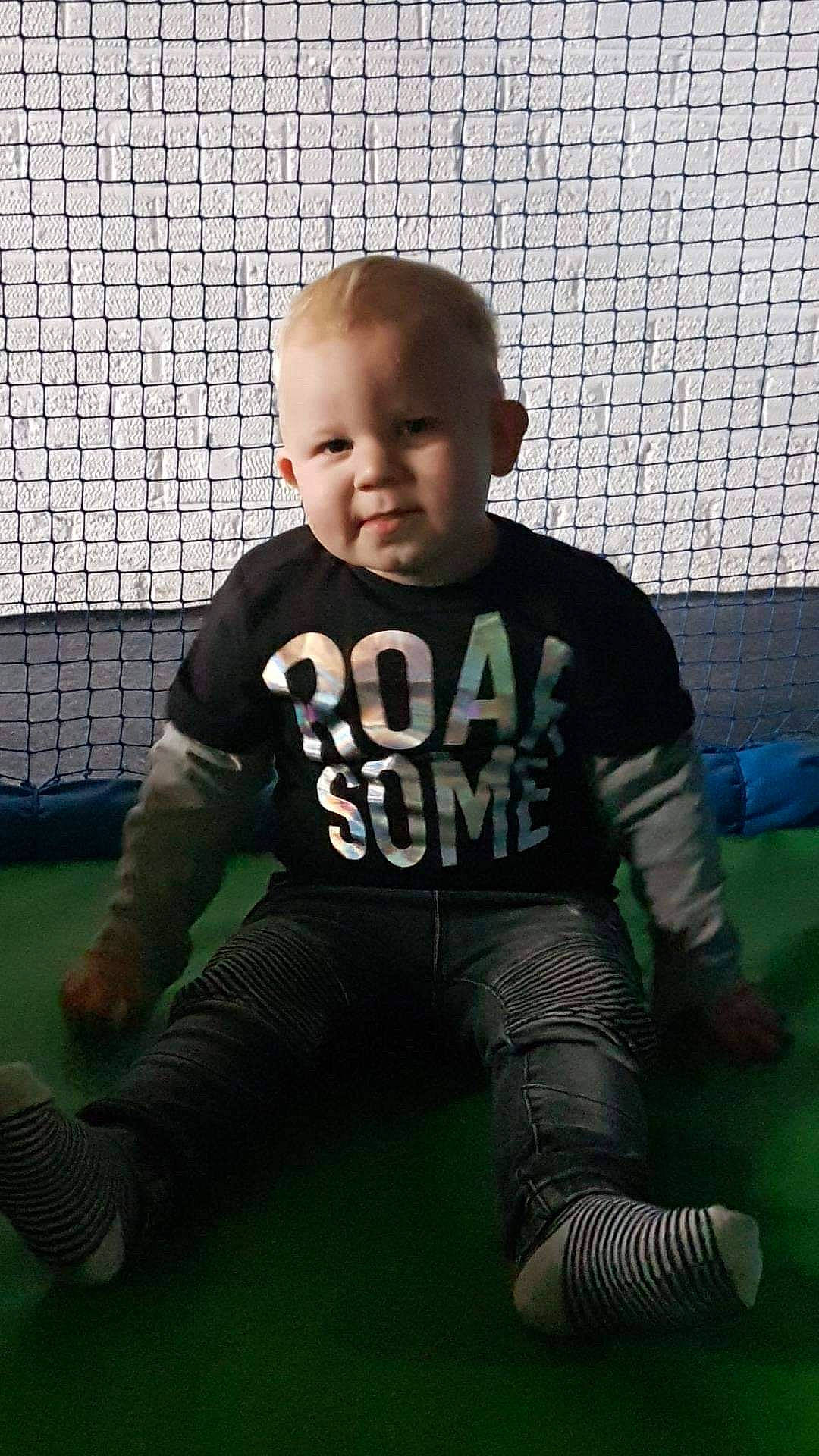 Ashley James Halliday joined the competition — help win amazing prizes! boy, child, cool, day, fun, girl, grass, green, male, person, play, product, recreation, sitting, snapshot, standing, t_shirt, toddler